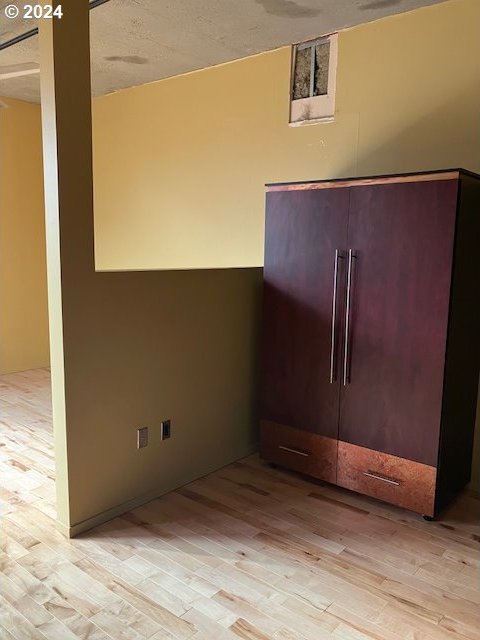 spare room with light hardwood / wood-style floors