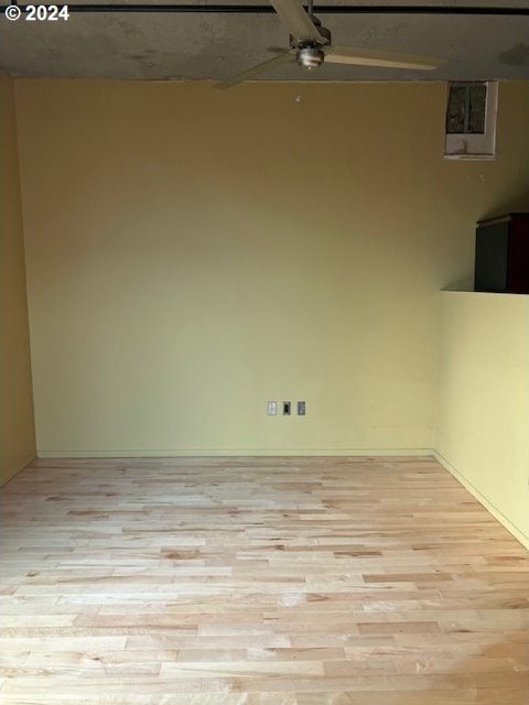 spare room with light wood-type flooring