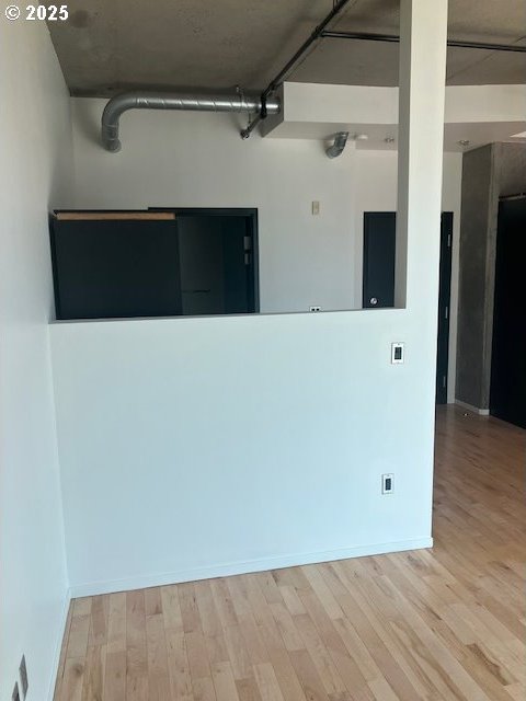 1410 SW 11th Ave Unit 402, Portland, OR 97201 - unfurnished room with wood finished floors