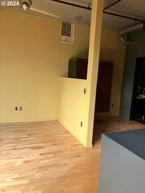 spare room with light wood-type flooring