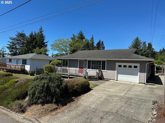 1635 S 16th St, Coos Bay, OR 97420 - ranch-style home with an attached garage and concrete driveway