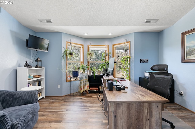 office area featuring hardwood / wood-style flooring and a textured ceiling