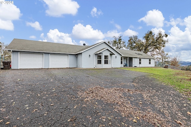 single story home featuring a garage