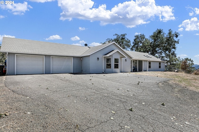 single story home featuring a garage