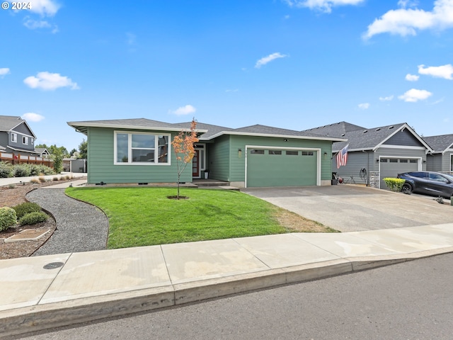 single story home featuring a front lawn and a garage