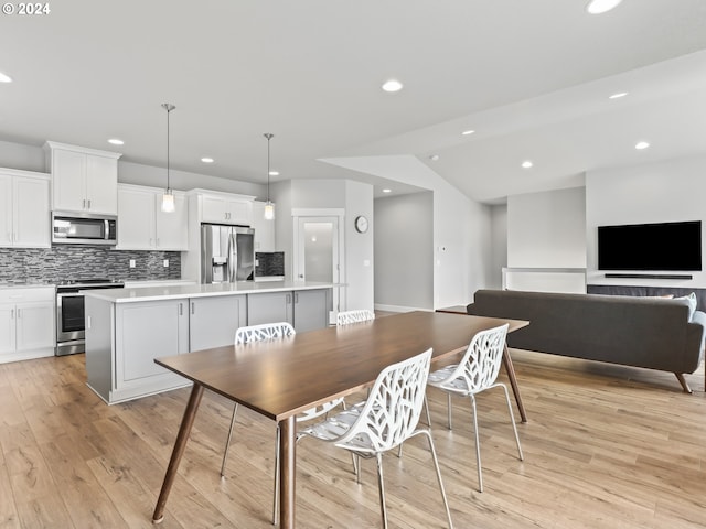 dining room with light wood-type flooring