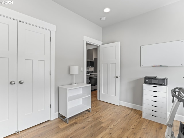 office area with light hardwood / wood-style floors