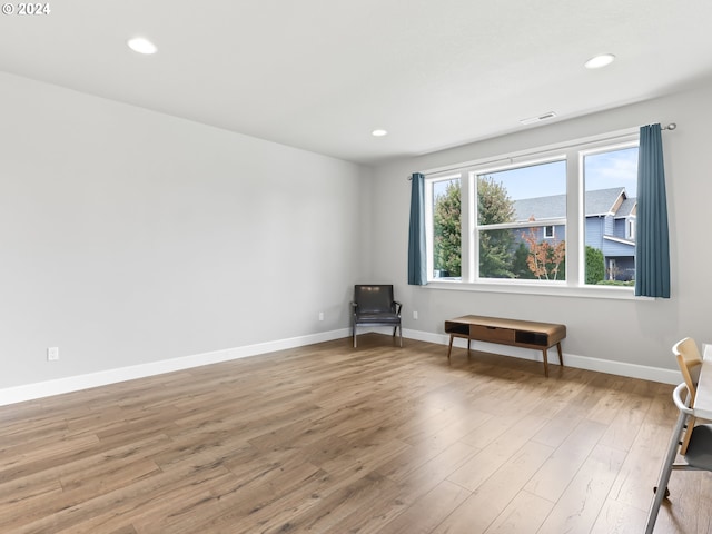 unfurnished room with hardwood / wood-style floors