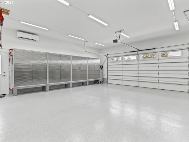 garage featuring a garage door opener and an AC wall unit