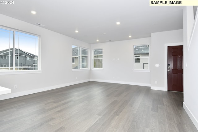 unfurnished living room featuring light hardwood / wood-style floors