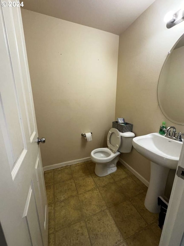 bathroom featuring toilet