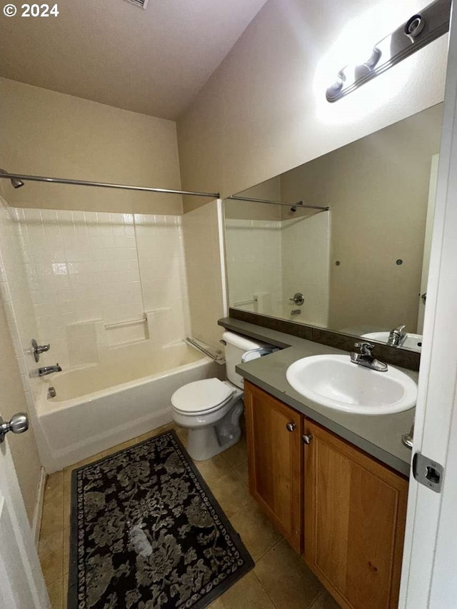 full bathroom with  shower combination, vanity, tile patterned flooring, and toilet