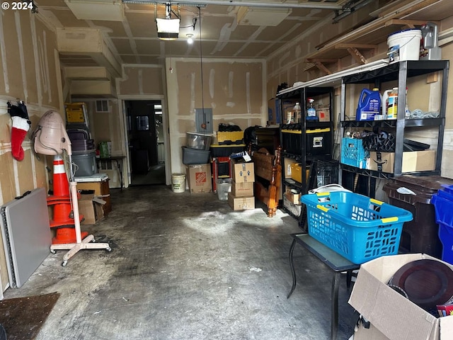 garage featuring a garage door opener and electric panel