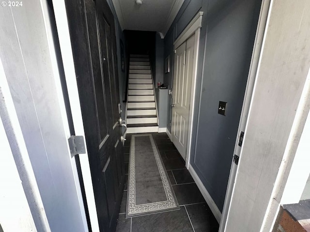 corridor featuring dark tile patterned flooring