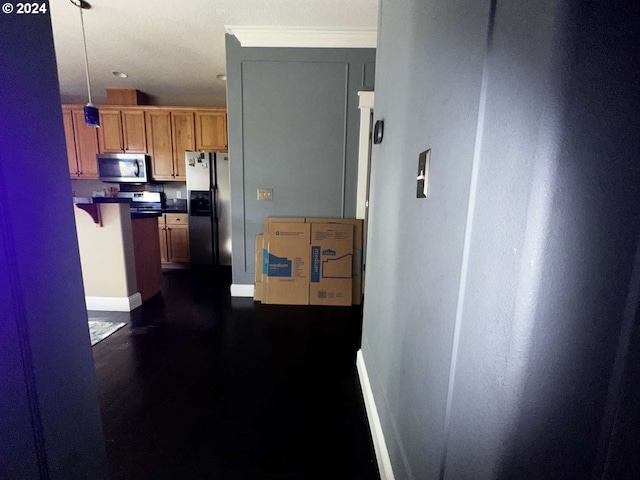 corridor with dark hardwood / wood-style floors and crown molding