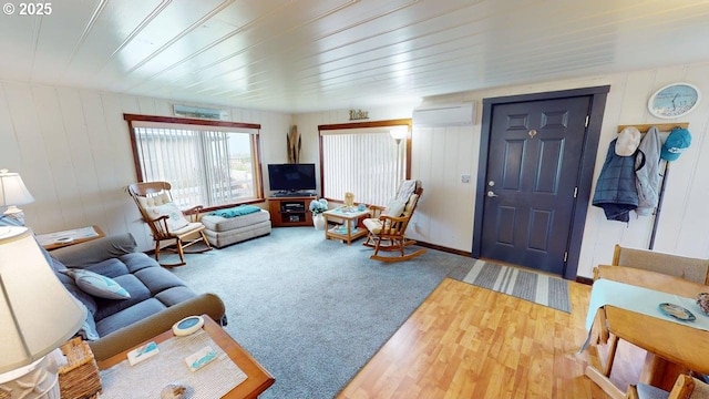 94142 4th St, Gold Beach, OR 97444 - living room with wood finished floors, a wall mounted air conditioner, and wood walls
