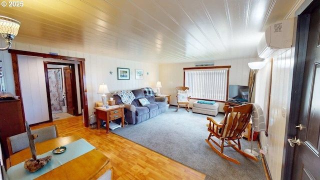 94142 4th St, Gold Beach, OR 97444 - living room featuring wood finished floors, wooden ceiling, and a wall mounted AC
