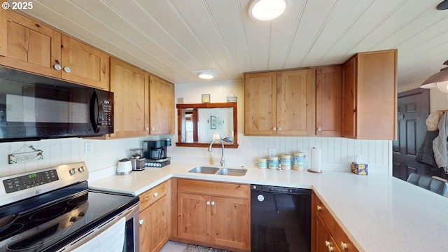 94142 4th St, Gold Beach, OR 97444 - kitchen featuring black appliances, a sink, and light countertops