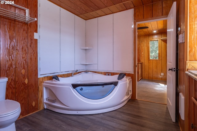 bathroom featuring toilet, wooden ceiling, wood finished floors, and wood walls