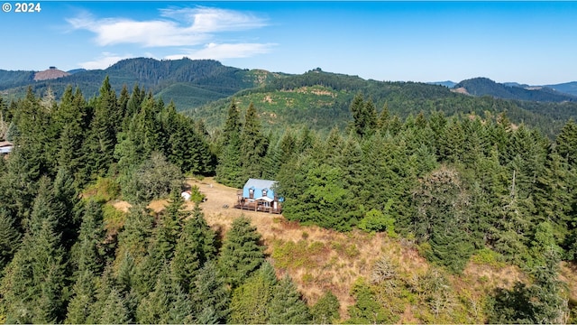 bird's eye view with a mountain view and a forest view