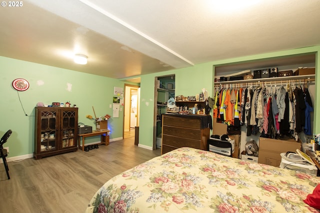 bedroom featuring a closet and hardwood / wood-style flooring