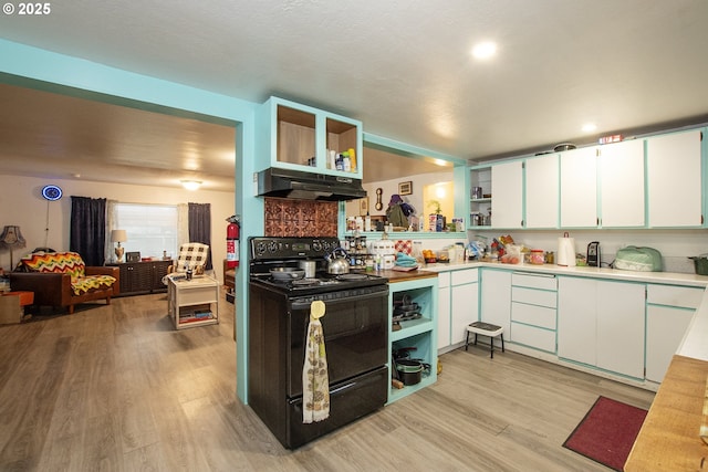 kitchen featuring light hardwood / wood-style floors, white cabinetry, black electric range, and backsplash