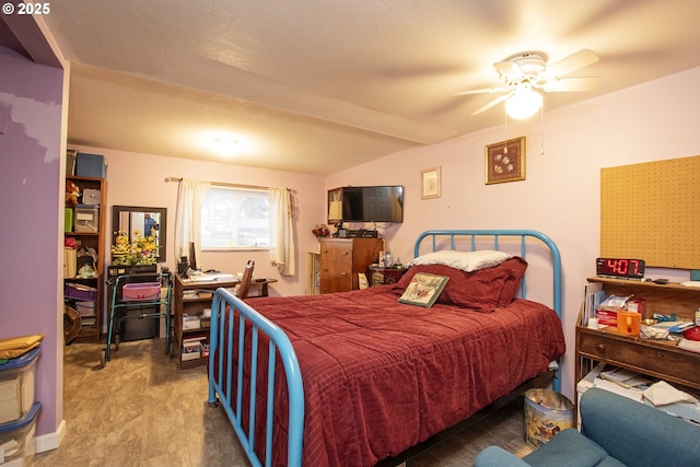 bedroom with beam ceiling, ceiling fan, and carpet flooring