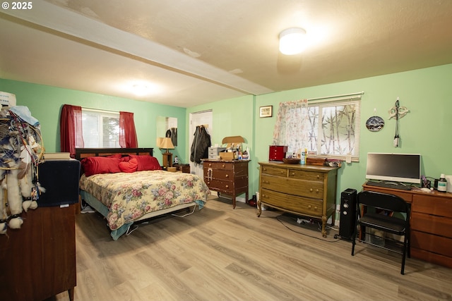 bedroom with hardwood / wood-style flooring