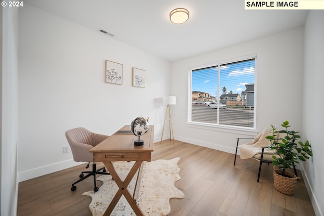 office with hardwood / wood-style floors