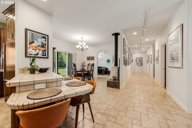 hall featuring an inviting chandelier