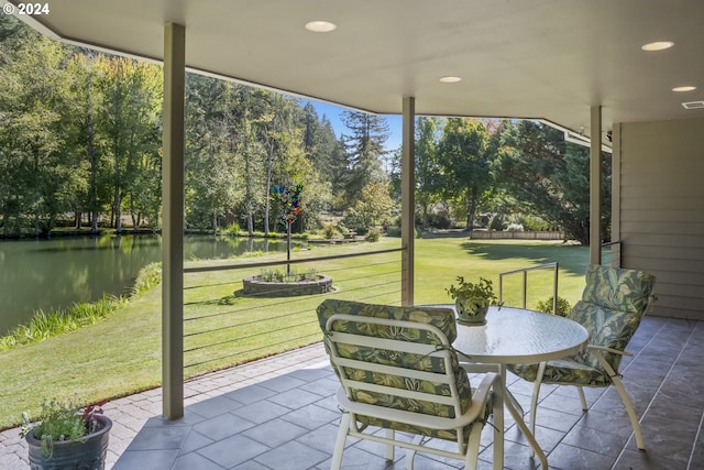 view of patio featuring a water view