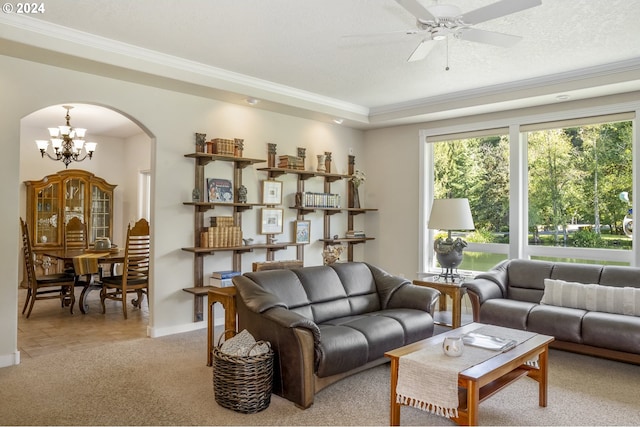 living room featuring ceiling fan with notable chandelier, crown molding, and light colored carpet