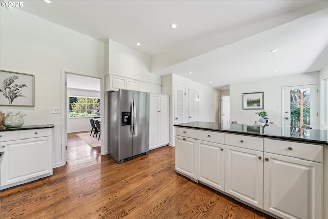 2585 Dellwood Dr, Lake Oswego, OR 97034 - kitchen featuring dark countertops, stainless steel fridge, recessed lighting, white cabinets, and light wood-style flooring
