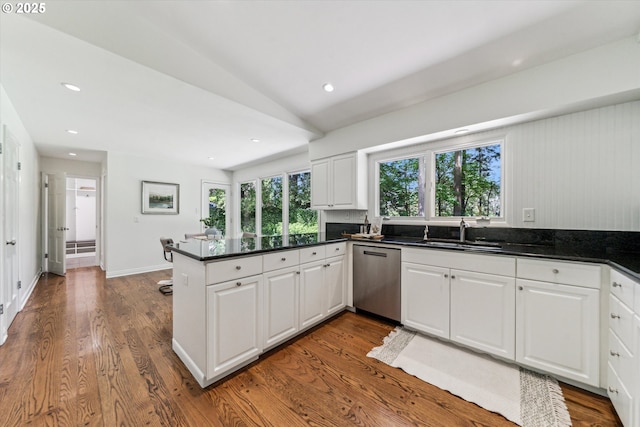 2585 Dellwood Dr, Lake Oswego, OR 97034 - kitchen with stainless steel dishwasher, a peninsula, dark countertops, white cabinets, and a sink