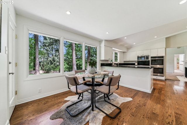 2585 Dellwood Dr, Lake Oswego, OR 97034 - dining space with baseboards, vaulted ceiling, recessed lighting, and wood finished floors
