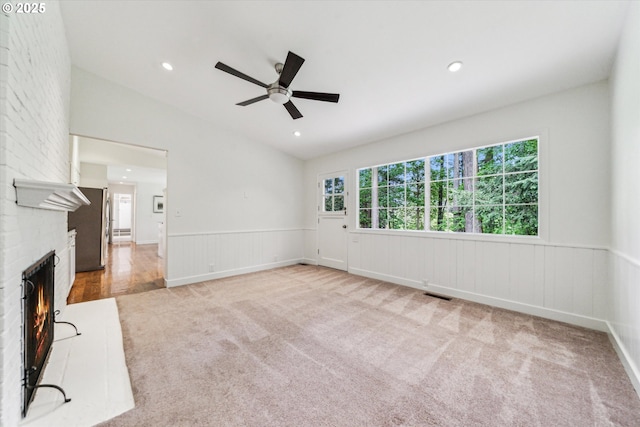 2585 Dellwood Dr, Lake Oswego, OR 97034 - unfurnished living room with ceiling fan, a fireplace, wainscoting, carpet floors, and recessed lighting