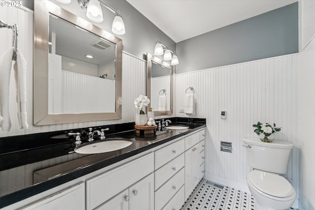2585 Dellwood Dr, Lake Oswego, OR 97034 - bathroom with double vanity, toilet, visible vents, and a sink