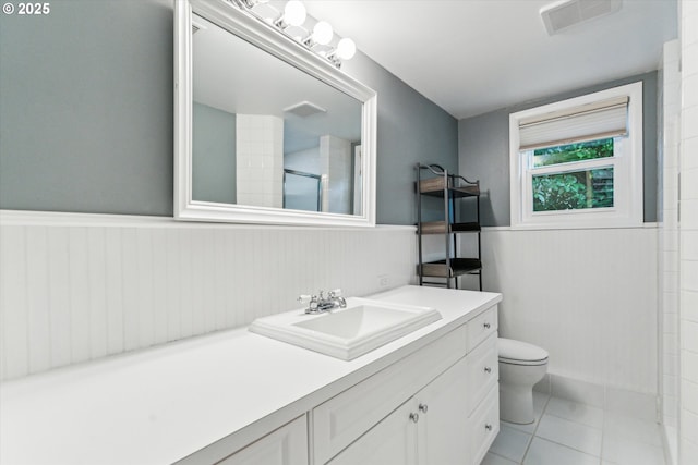 2585 Dellwood Dr, Lake Oswego, OR 97034 - full bath with visible vents, wainscoting, a shower, vanity, and toilet