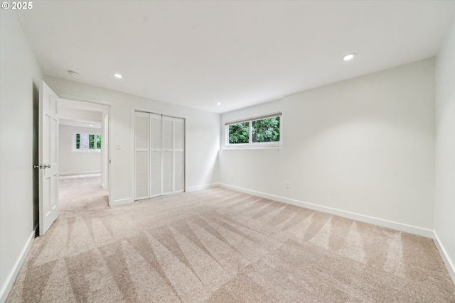 2585 Dellwood Dr, Lake Oswego, OR 97034 - unfurnished bedroom featuring baseboards, a closet, recessed lighting, and light colored carpet