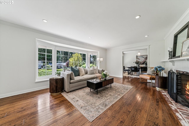 2585 Dellwood Dr, Lake Oswego, OR 97034 - living room featuring wood-type flooring, ornamental molding, baseboards, and a brick fireplace