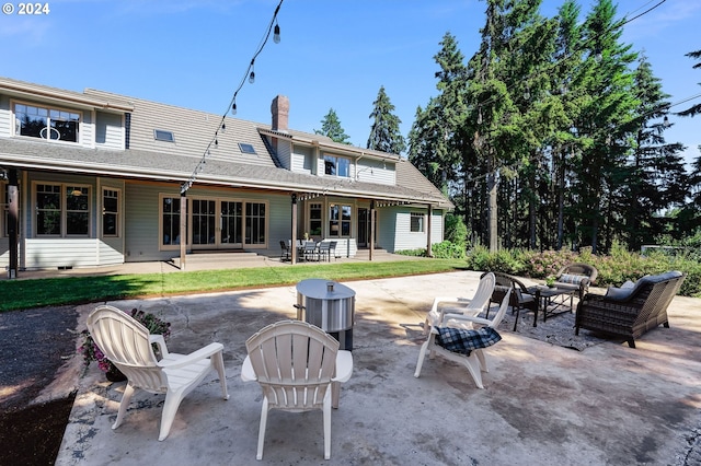 back of property featuring a patio area