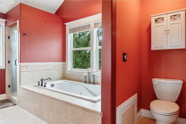 bathroom featuring tile patterned floors, toilet, and shower with separate bathtub