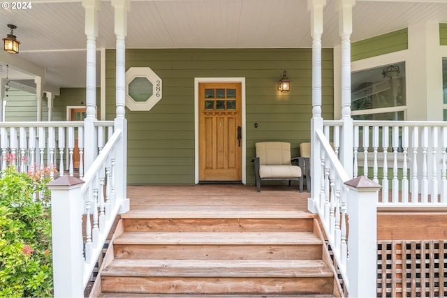 property entrance featuring a porch