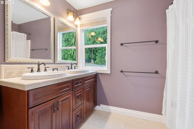 bathroom with vanity, tile patterned flooring, and tasteful backsplash