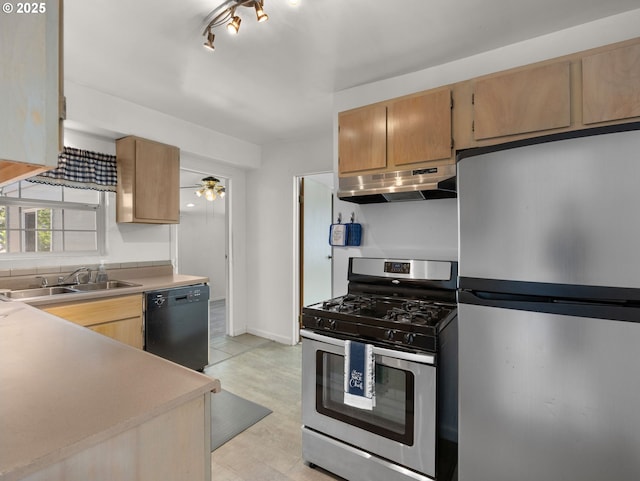 430 SE Elliott Ave, Gresham, OR 97080 - kitchen with a sink, light countertops, stainless steel appliances, baseboards, and under cabinet range hood