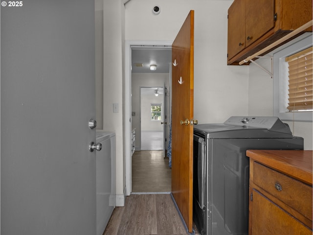 430 SE Elliott Ave, Gresham, OR 97080 - washroom featuring a ceiling fan, light wood finished floors, cabinet space, and washer and dryer
