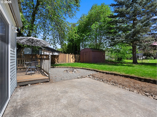 430 SE Elliott Ave, Gresham, OR 97080 - view of patio with a deck, an outbuilding, a fenced backyard, and a storage unit