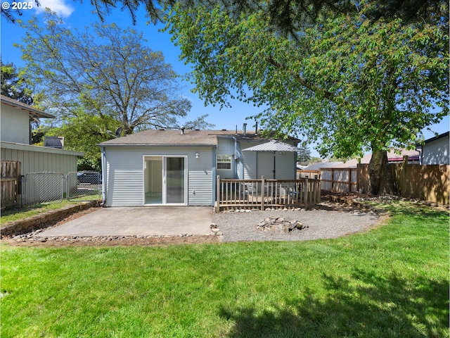 430 SE Elliott Ave, Gresham, OR 97080 - back of property featuring a lawn, a patio, and a fenced backyard