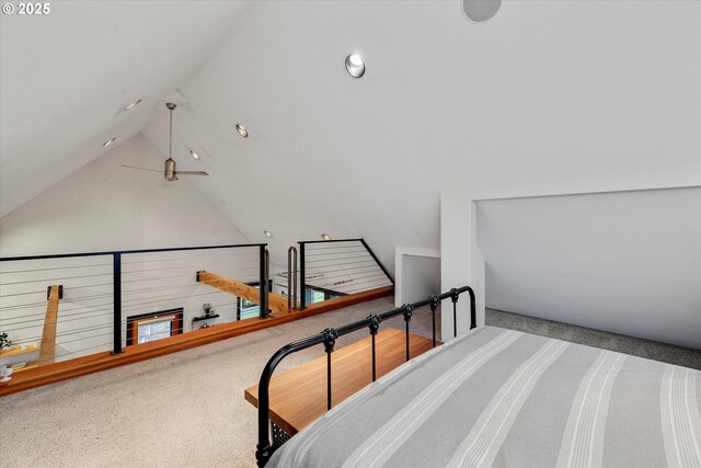 bedroom featuring lofted ceiling and carpet