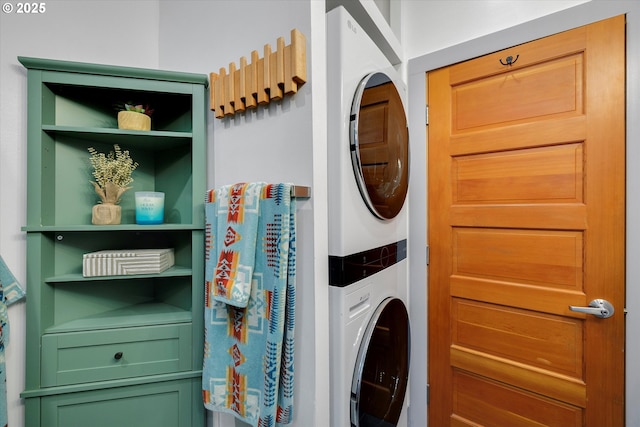 laundry room featuring stacked washer and dryer and laundry area